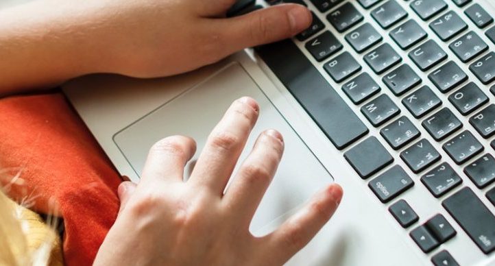 notebook person setting up a free online store